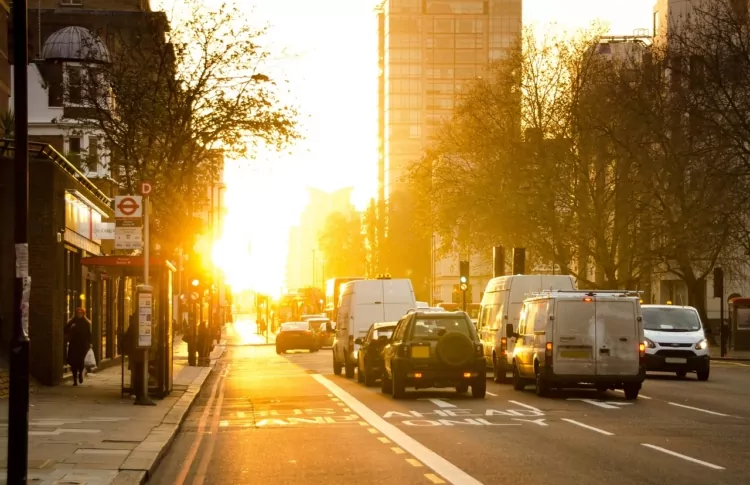 A busy city with bright low sun