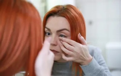 A woman putting in a contact lens